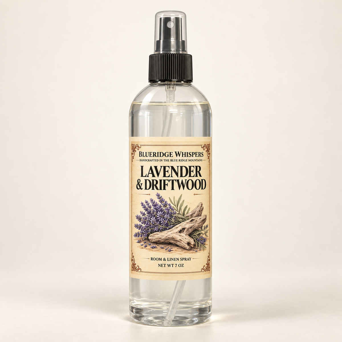 Lavender & Driftwood room and fabric spray by BlueRidge Whispers, net weight 7 oz, clear bottle with black fine-mist sprayer and parchment label.