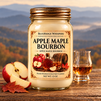 Apple Maple Bourbon candle on rustic wood with apple, maple leaf and bourbon accents, with softly blurred Blue Ridge mountains.