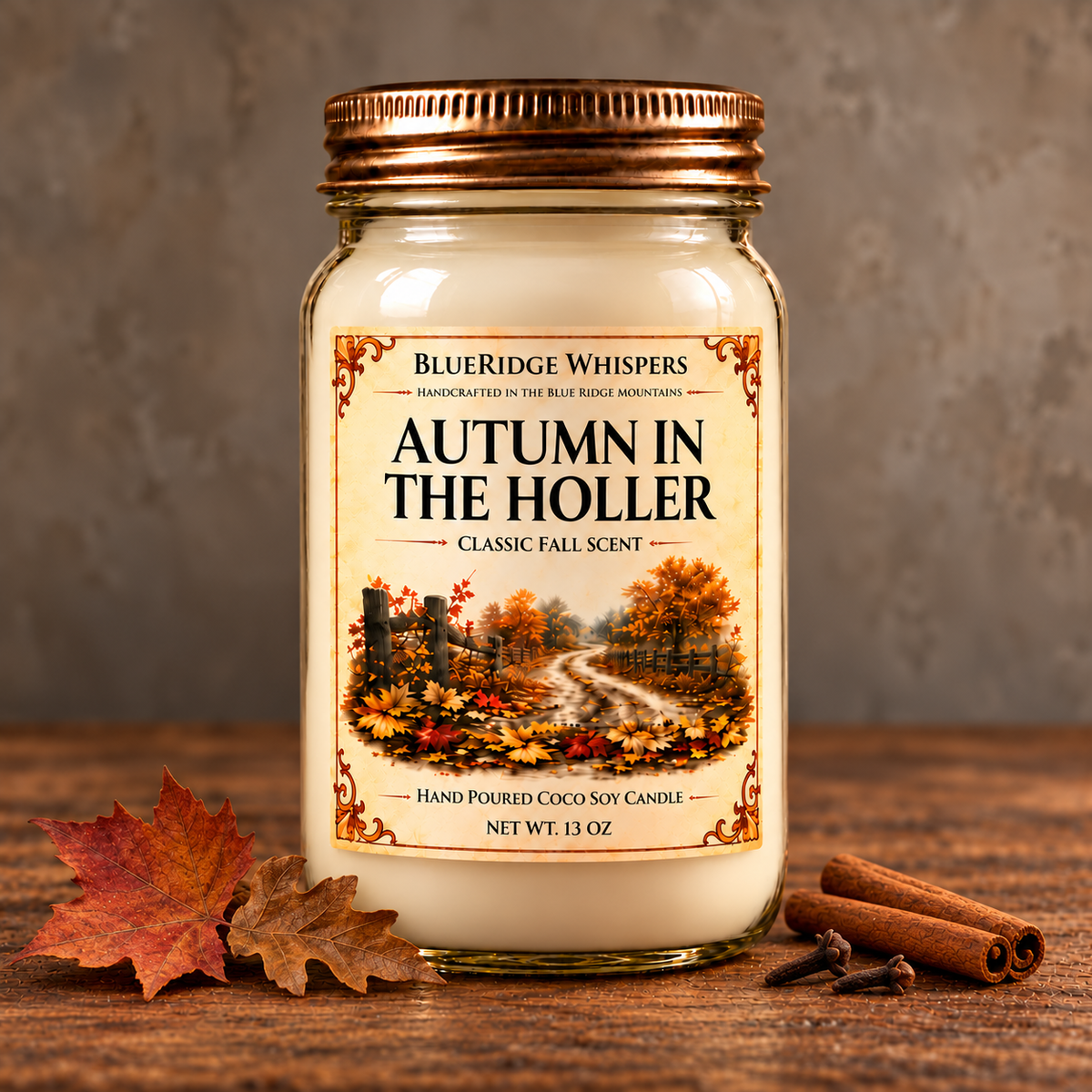 Autumn in the Holler – Fallen Leaves Coco-Soy Candle on weathered wood against a neutral plaster wall with small scent accents.