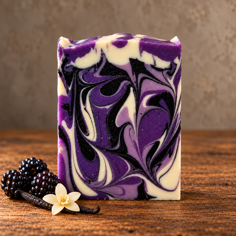 Black Raspberry Vanilla Handcrafted Soap in a rustic indoor setting with ingredient accents