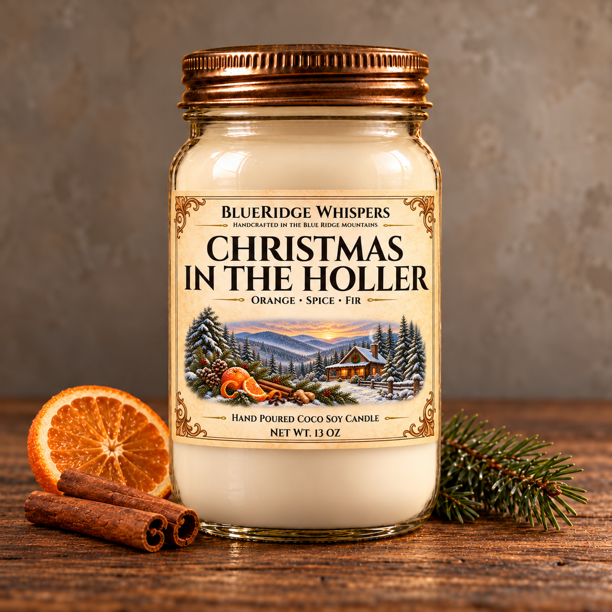 Christmas in The Holler candle with its Orange, Spice, and Fir label in a copper-lidded mason jar, styled with orange, cinnamon, and evergreen on rustic wood.
