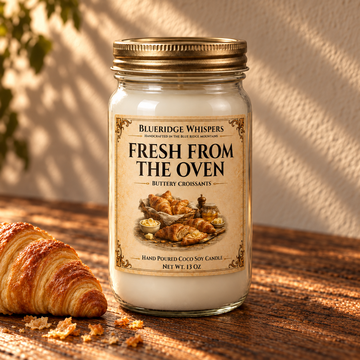 Fresh From the Oven – Warm Croissant Coco-Soy Candle on a dark rustic wooden table with scent accents in warm natural light.