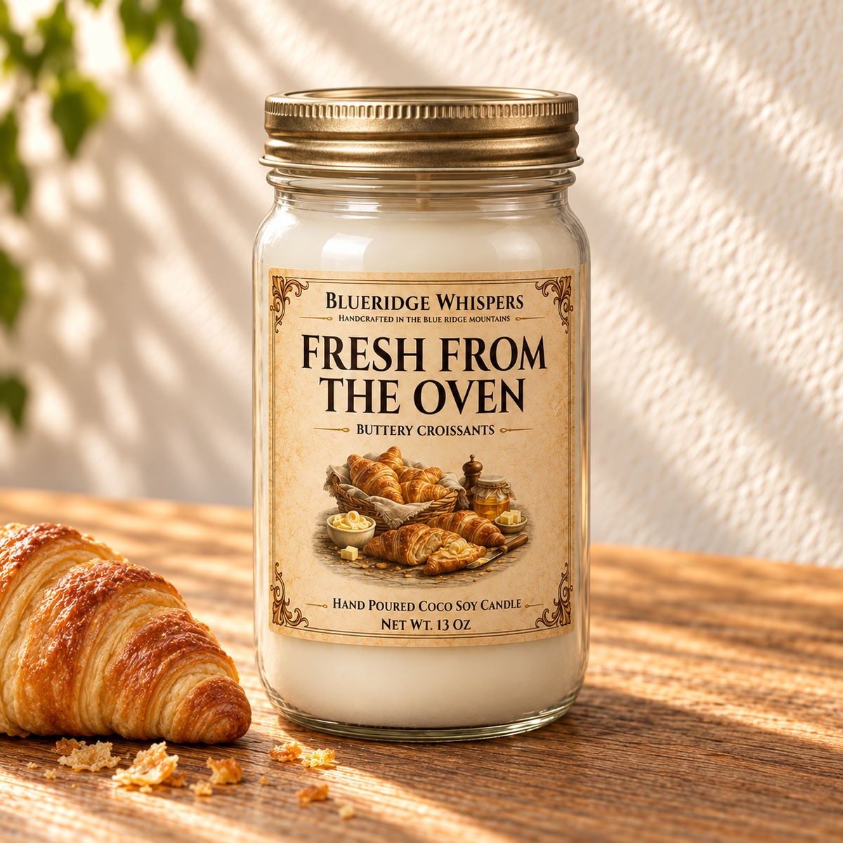 Fresh From the Oven – Warm Croissant Coco-Soy Candle in a tall gold-lidded mason jar on sunlit wood with scent accents.