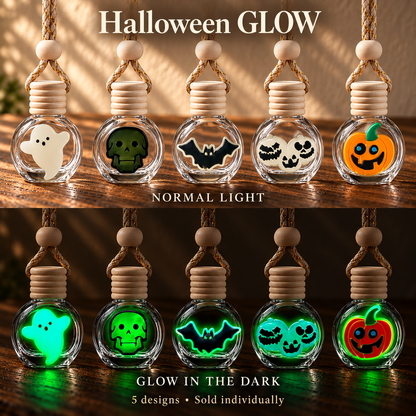 All five Halloween car freshener designs—Ghost, Skull, Bat, 3 Pumpkins, and Classic Pumpkin—shown in normal light and glowing in the dark. Sold individually.