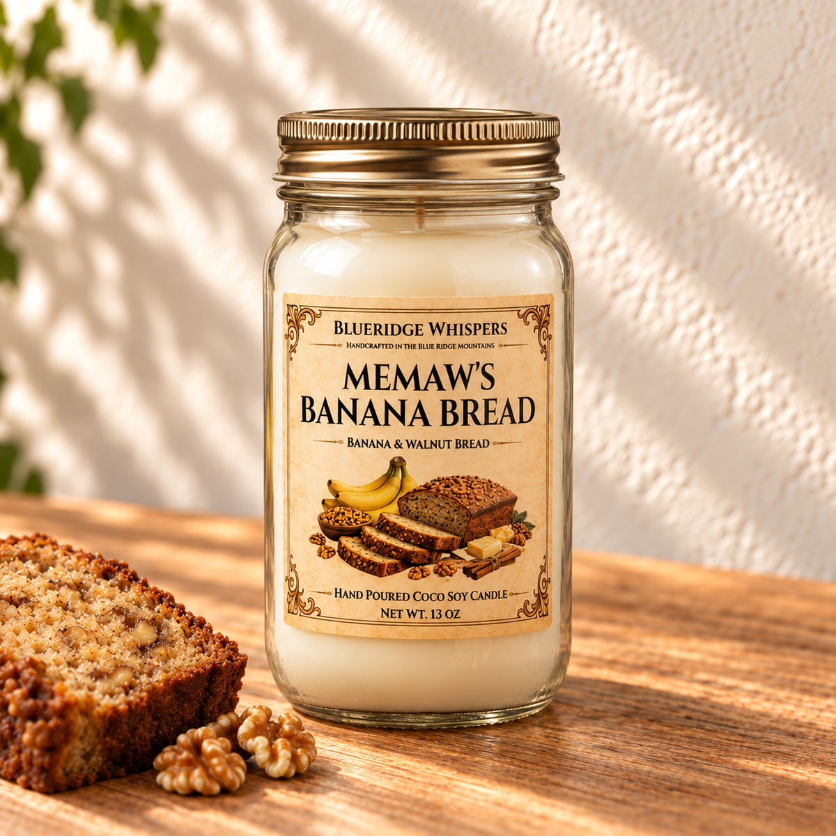 Memaw’s Banana Bread – Bakery Coco-Soy Candle in a tall gold-lidded mason jar on sunlit wood with scent accents.