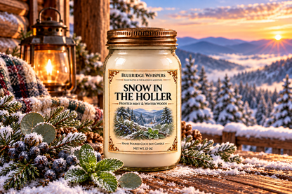 Snow in The Holler candle on a rustic porch overlooking snowy Blue Ridge mountains with mint and juniper accents.